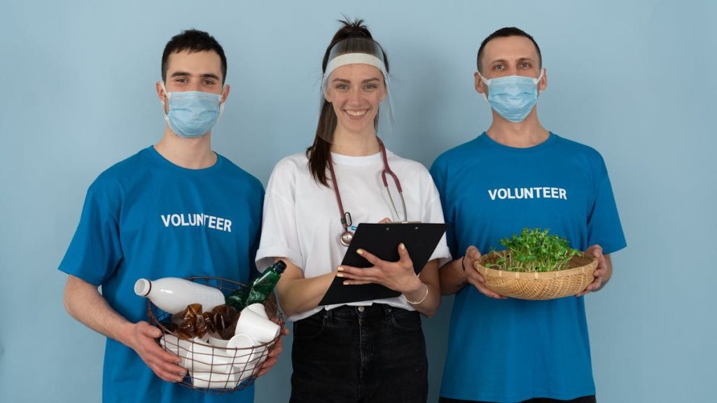 Team of volunteers engaged in community health and environmental activities with a joyful spirit.