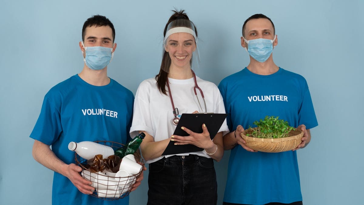 Team of volunteers engaged in community health and environmental activities with a joyful spirit.